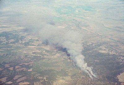 Brush fire in central Oregon: Two plumes of particles emanate from a brush fire in central Oregon in this mid-summer scene from 1991. MISR monitors particle amounts over land and ocean.
