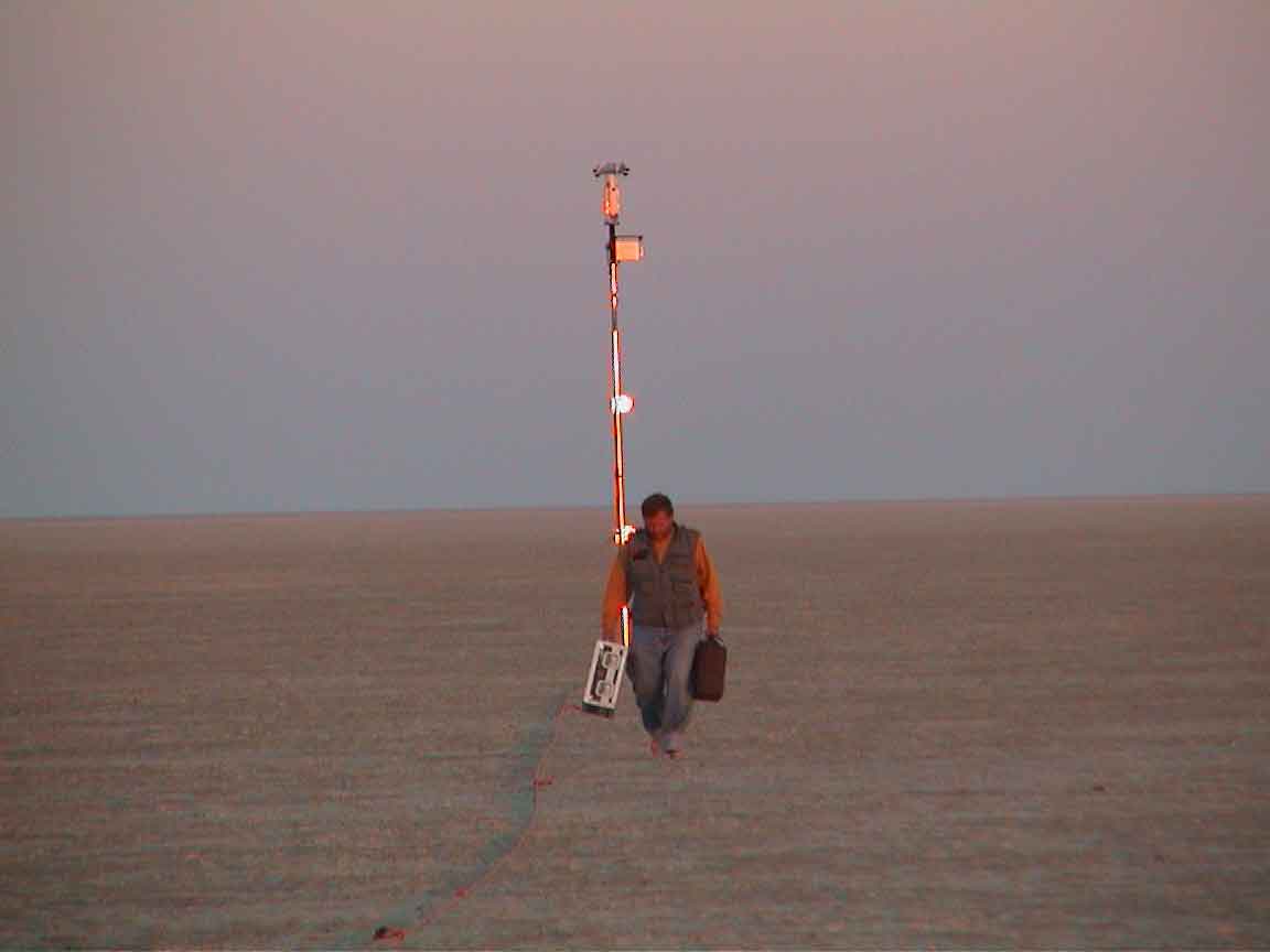 Today is a Terra satellite overpass day, 09:16UT. All instruments working.  Did kilometers of ASD reflectance transects. Saw AeroCommanders overhead. This photo is of me walking back from PARABOLA after setting it up in the wee hours of the dawn.  Note the new stand.  That's only half the monster.